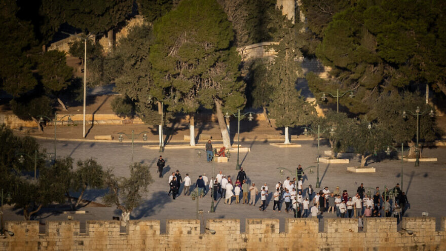 Jews visit the Temple Mount compound in Jerusalem's Old City, as seen from the Mount of Olives observatory, on Oct. 16, 2022. Photo by Yonatan Sindel/Flash90.