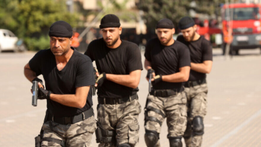 Hamas security personnel display their skills during a police academy graduation ceremony in Gaza City, Oct. 31, 2022. Photo by Attia Muhammed/Flash90.