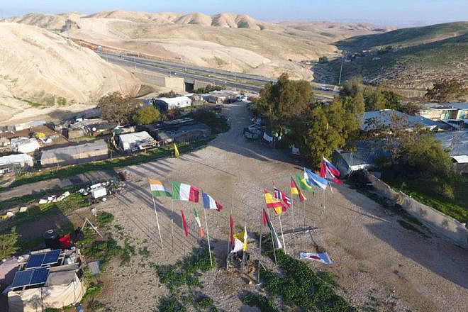 The E.U.-funded illegal Palestinian outpost of Khan al-Ahmar, in the E1 area east of Jerusalem, with Israel Route 1 in the background. Credit: Regavim.