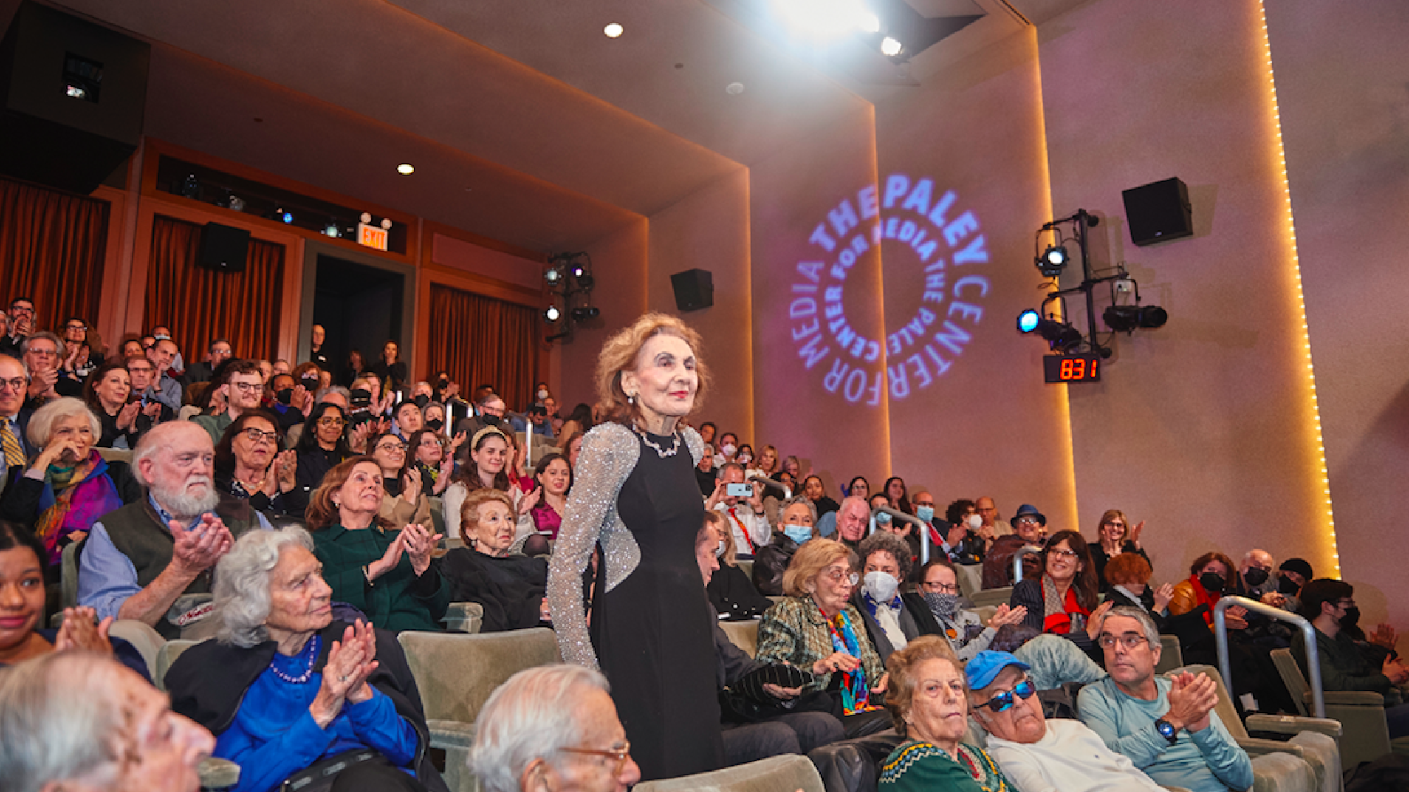 Holocaust survivor Helena Weinrauch, who appears in “Reckonings,” stands and receives a round of applause at The Paley Center for Media in Manhattan. Credit: Perry Bindelglass.
