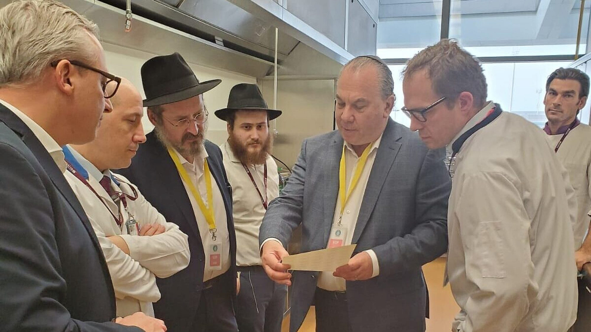 Rabbi Marc Schneier (center) with Rabbi Mendy Chitrik (third left) looking on and behind him his son, Rabbi Eliyahu Chitrik, in Doha, Qatar. Courtesy.