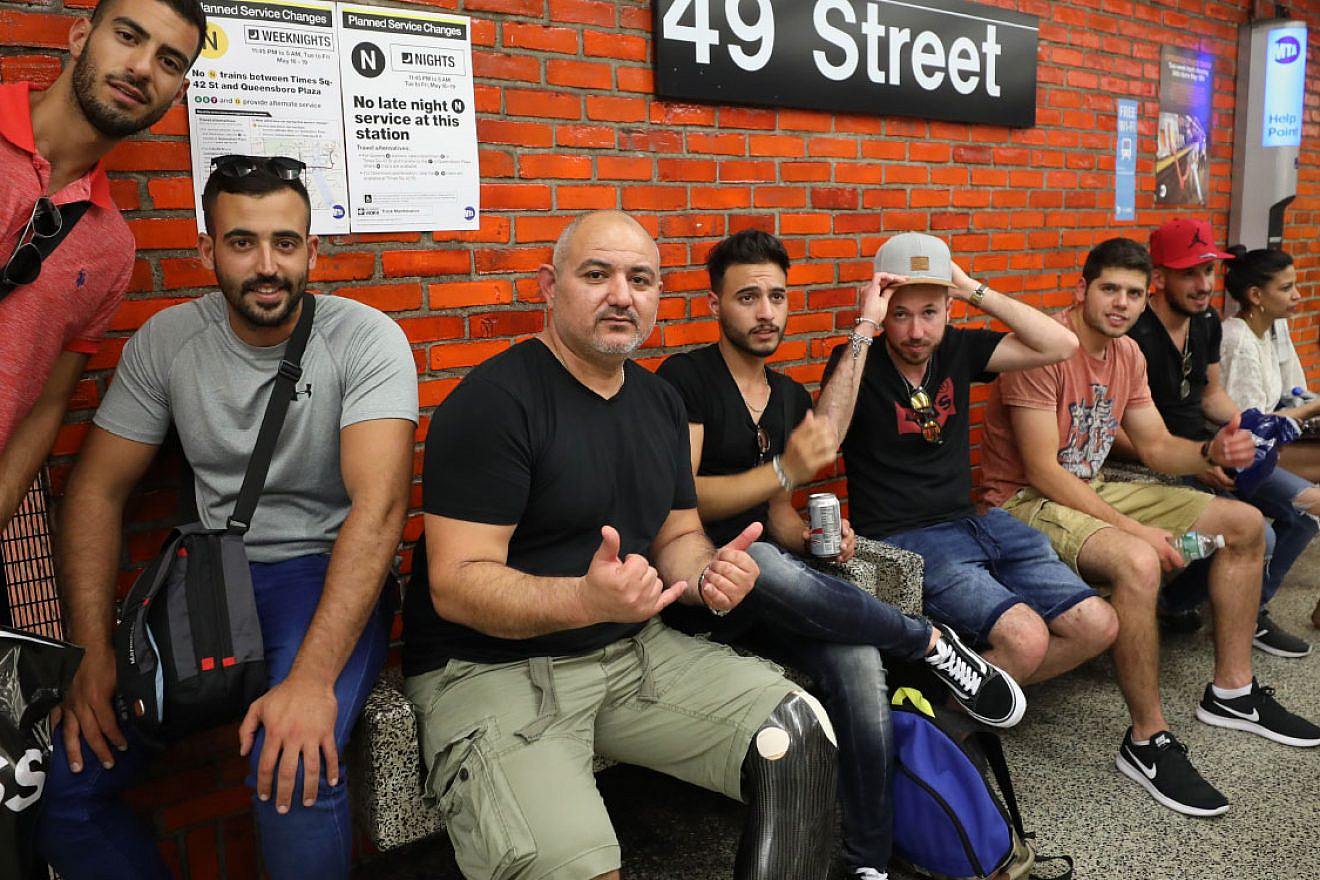 IDF veterans wait for the subway in Manhattan. Source: belevechad.nyc.