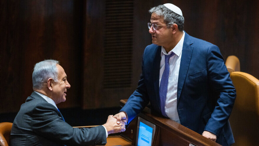 Incoming Prime Minister Benjamin Netanyahu speaks with incoming National Security Minister Itamar Ben-Gvir at the Knesset in Jerusalem, Dec. 28, 2022. Photo by Olivier Fitoussi/Flash90.