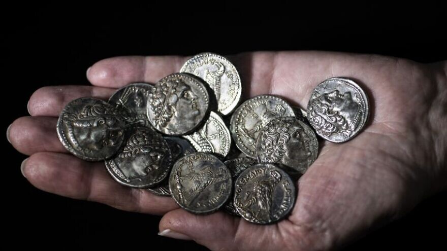 A 2,200-year-old cache of silver coins found in the Judean Desert. Photo by Shai Halevi/Israel Antiquities Authority.