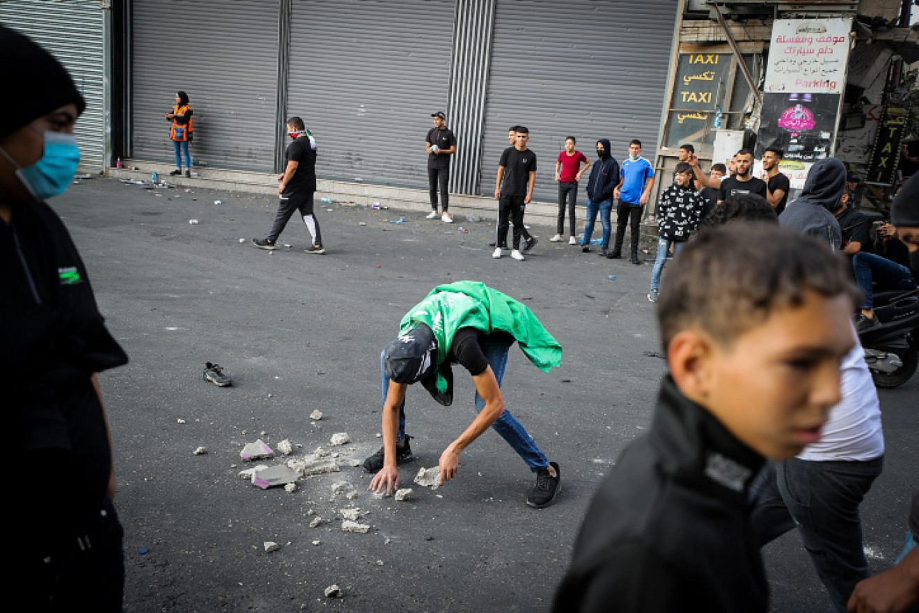 Palestinian youths clash with Israeli security forces in Shuafat, Oct. 12, 2022. Photo by Jamal Awad/Flash90.