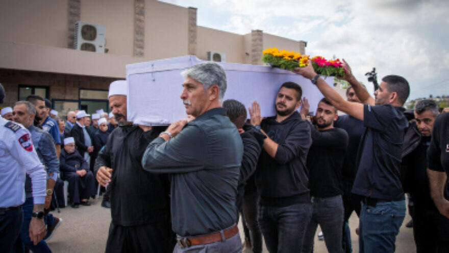 Mourners participate in the funeral procession of Tiran Fero, an Israeli teenager whose body was snatched from a hospital in Jenin by Palestinian terrorists and returned to Israel on Nov. 24, in Daliyat al-Karmel, near Haifa, Nov. 24, 2022. Photo by Shir Torem/Flash90.