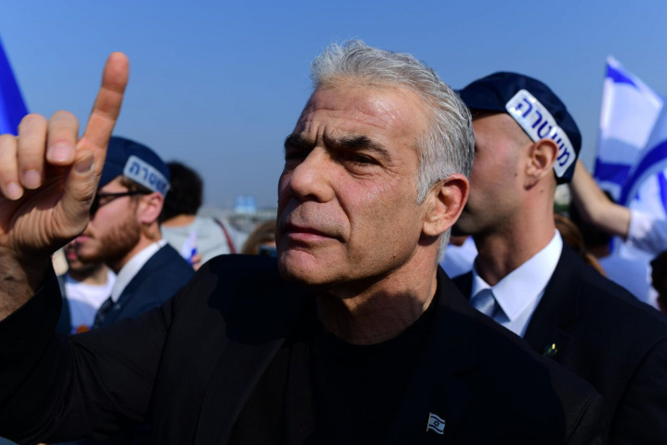 Outgoing Israeli Prime Minister Yair Lapid and Yesh Atid Party activists protest in Tel Aviv against Benjamin Netanyahu's incoming government, Dec. 9, 2022. Photo by Tomer Neuberg/Flash90.