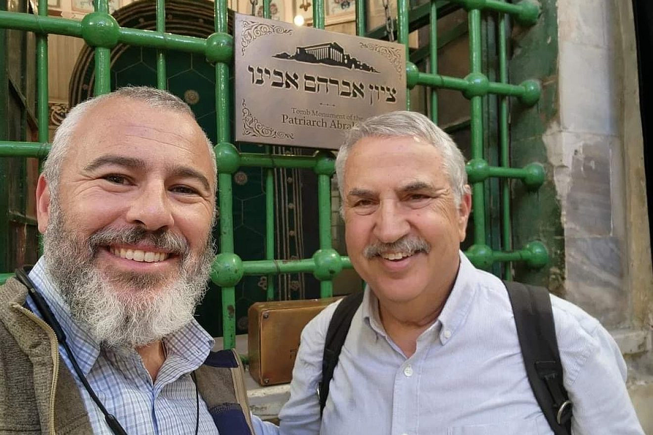 Yishai Fleisher (left), spokesman for the Jewish Community of Hebron, with Thomas L. Friedman of “The New York Times” at the Cave of the Patriarchs, Dec. 1, 2022. Credit: Courtesy.
