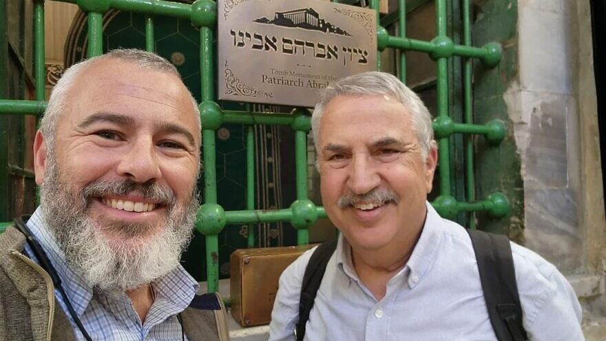 Yishai Fleisher (left), spokesman for the Jewish community of Hebron, and "New York Times" columnist Thomas Friedman pose at the Cave of the Patriarchs in the city, Dec. 1 2022. Courtesy photo.