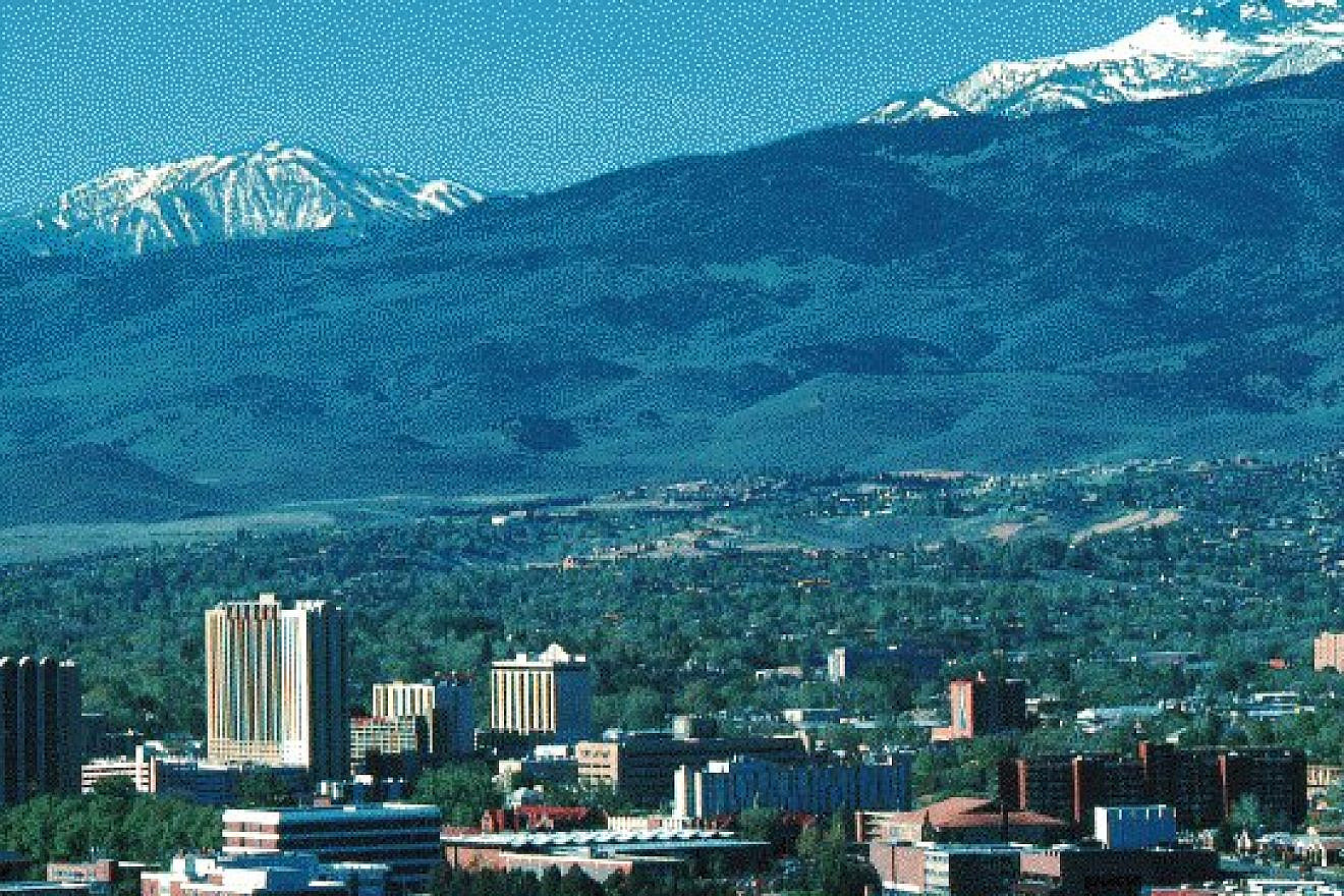 An older picture showing part of the University of Nevada, Reno campus in the foreground. Source: Wikimedia Commons.