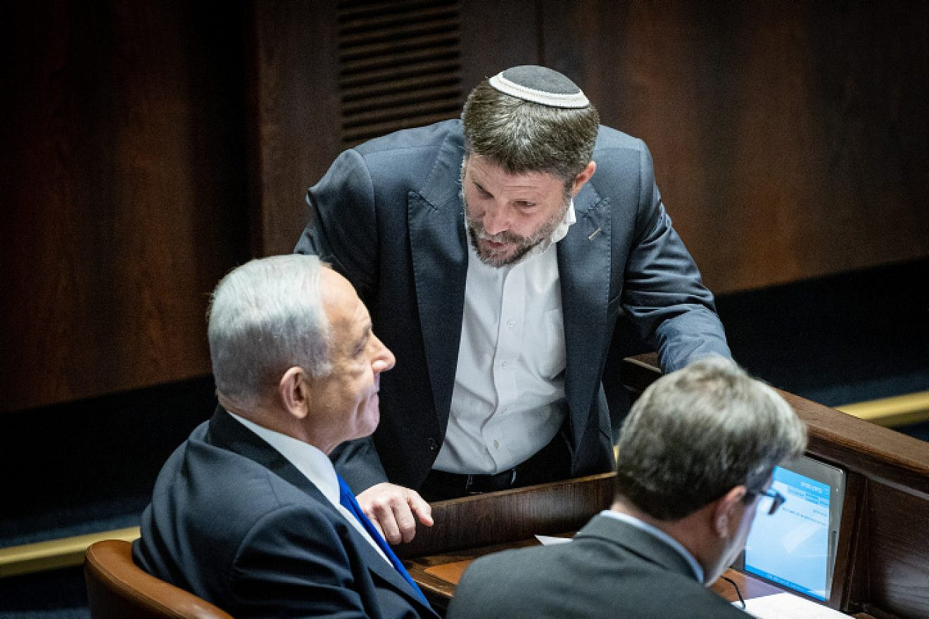 Prime Minister-designate Benjamin Netanyahu speaks with Religious Zionism Party head Bezalel Smotrich during a vote at the Knesset in Jerusalem, Dec. 20, 2022. Photo by Yonatan Sindel/Flash90.