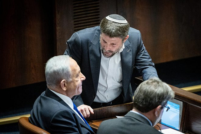 Israeli Prime Minister-designate Benjamin Netanyahu speaks with Religious Zionism Party head Bezalel Smotrich during a vote at the Knesset in Jerusalem, Dec. 20, 2022. Photo by Yonatan Sindel/Flash90.