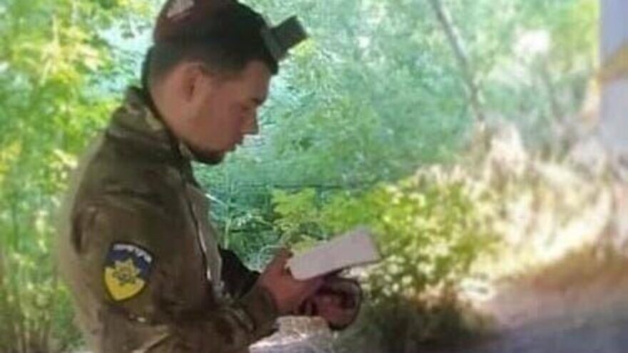 Jewish Ukrainian soldier Vladislav Shain praying. (Courtesy).