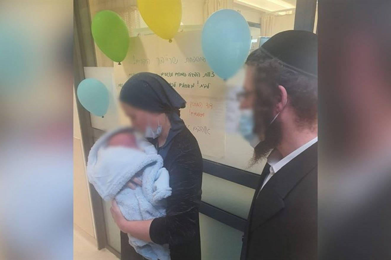 Liba Ahuva Schreiber leaves hospital with her child (Shaarei Tzedek Medical Center)