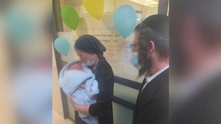 Liba Ahuva Schreiber leaves hospital with her child (Shaarei Tzedek Medical Center)