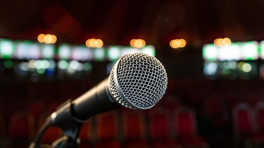 Microphone on a stand in a comedy venue at the Edinburgh Fringe Arts Festival. Source: Shutterstock.