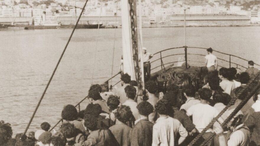 Passengers view Mount Carmel from the deck of the Mala immigrant ship as it enters the port of Haifa, July 11, 1948. Credit: United States Holocaust Memorial Museum, courtesy of Martin Silver.