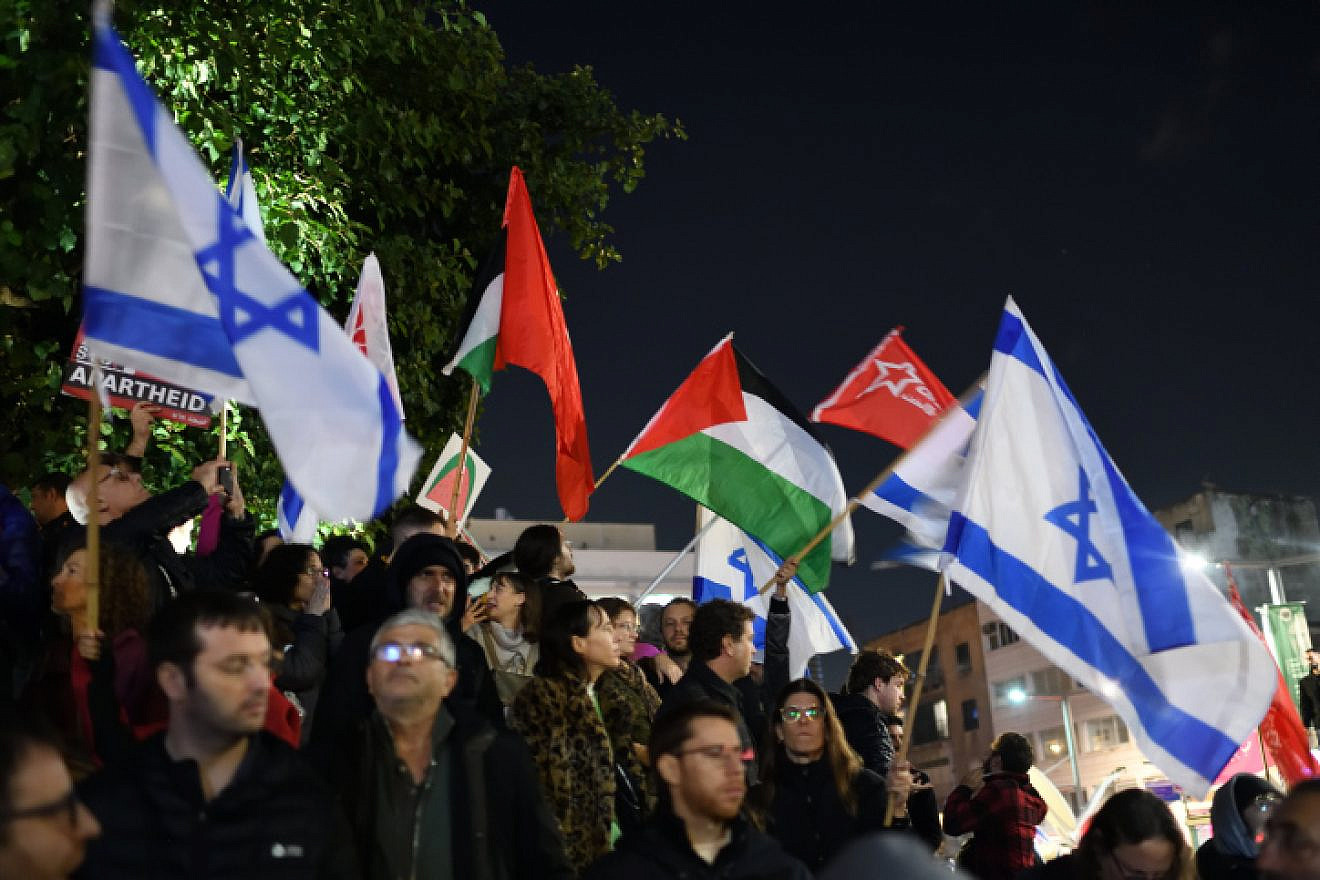 Palestinian flags waved at the rally against Israeli Prime Minister Benjamin Netanyahu's judicial reforms in Tel Aviv, Jan. 14, 2023. Photo by Gili Yaari /Flash90.