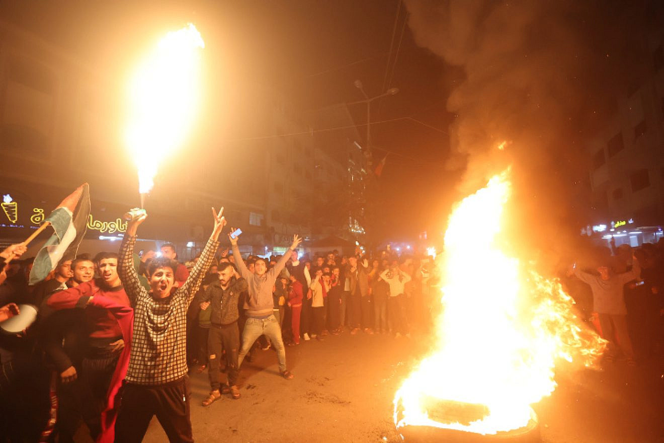 Palestinians celebrate in Gaza City following a terror attack in Jerusalem that left seven Israelis dead, on Jan. 27, 2023. Photo by Atia Mohammed/Flash90.