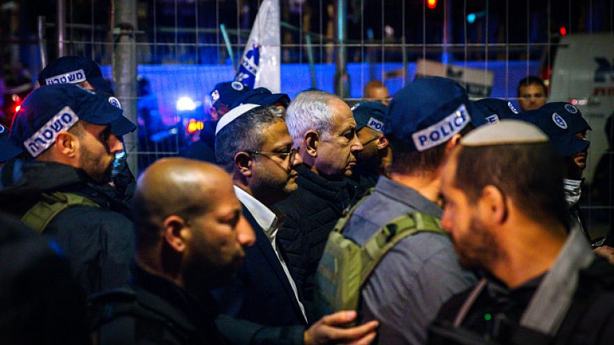Israeli Prime Minister Benjamin Netanyahu and Israeli National Security Minister Itamar Ben-Gvir at the scene of a deadly Palestinian terrorist attack in Jerusalem, Jan. 27, 2023. Credit: Olivier Fitoussi/Flash90.