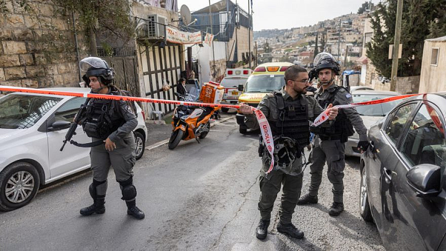 Security personnel guard the scene outside the Old City of Jerusalem where a Palestinian gunman wounded an Israeli father and son, Jan. 28, 2023. Photo by Yonatan Sindel/FLASH90.