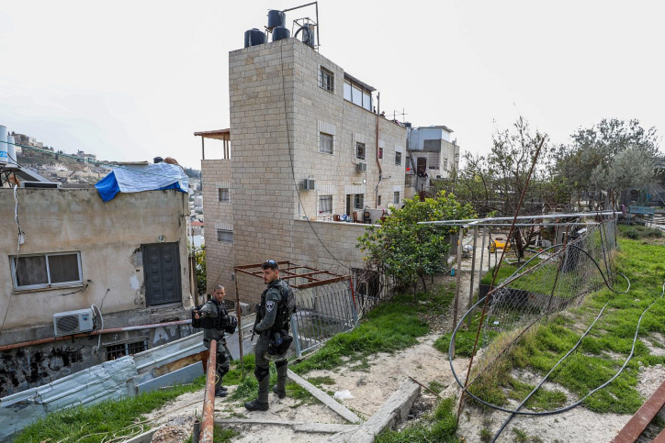 Israeli Border Police officers guard outside the home of Palestinian terrorist Alqam Khayri, who murdered 7 people in a shooting attack at a synagogue in Jerusalem, after it was sealed by security forces, Jan. 29, 2023. Credit: Jamal Awad/Flash90.