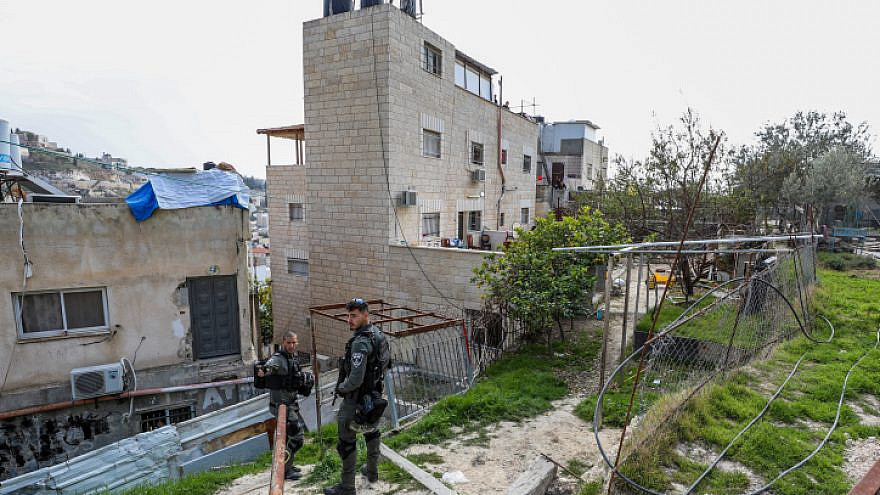 Israeli Border Police officers guard outside the home of Palestinian terrorist Alqam Khayri, who murdered 7 people in a shooting attack at a synagogue in Jerusalem, after it was sealed by security forces, Jan. 29, 2023. Credit: Jamal Awad/Flash90.