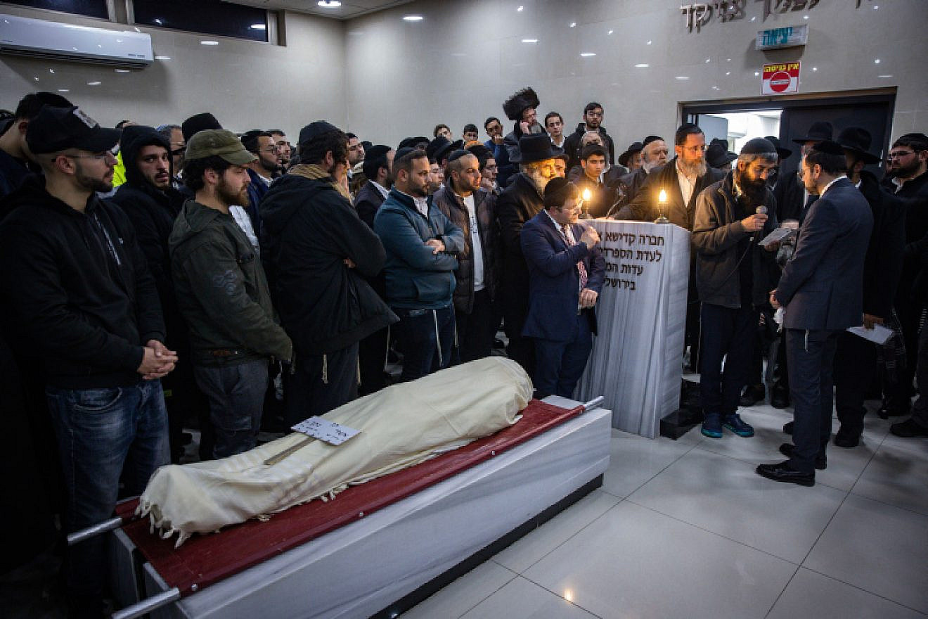 Family and friends attend the funeral of 14-year-old Asher Natan, who was killed in a terrorist attack in Jerusalem's Neve Yaakov neighborhood on Friday evening, in the Beit Shemesh Cemetery on Jan. 28, 2023. Photo by Olivier Fitoussi/Flash90.
