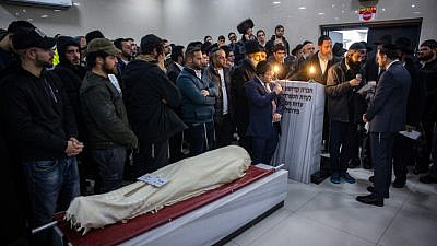 Family and friends attend the funeral of 14-year-old Asher Natan, who was killed in a terrorist attack in Jerusalem's Neve Yaakov neighborhood on Friday evening, in the Beit Shemesh Cemetery on Jan. 28, 2023. Photo by Olivier Fitoussi/Flash90.