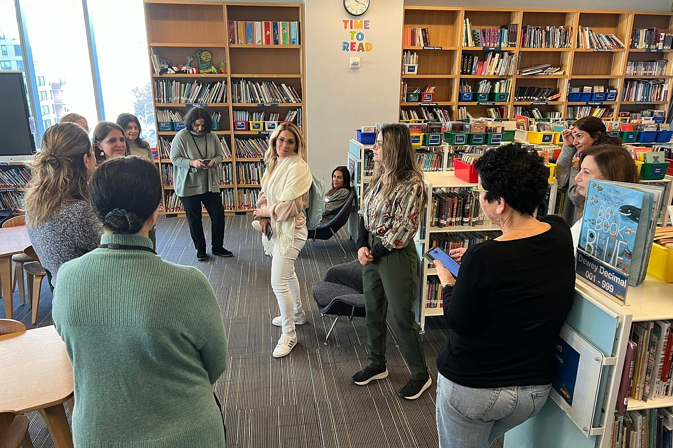 The Halleli progam participants visit the library at the Abraham Joshua Heschel School in Manhattan. Courtesy of TALI.