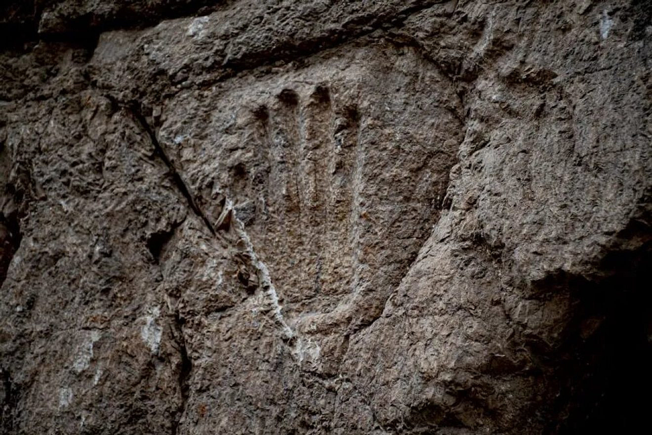 This 10th-century handprint was found in the moat surrounding Jerusalem's Old City. Photo by Yoli Schwartz/Israel Antiquities Authority.