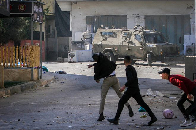 Palestinians attack Israeli security forces during a raid in Jenin on Jan. 26, 2023.  Photo by Nasser Ishtayeh/Flash90.