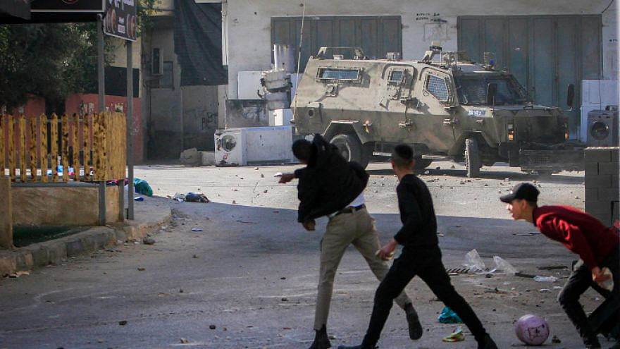 Palestinians attack Israeli security forces during a raid in Jenin on Jan. 26, 2023.  Photo by Nasser Ishtayeh/Flash90.