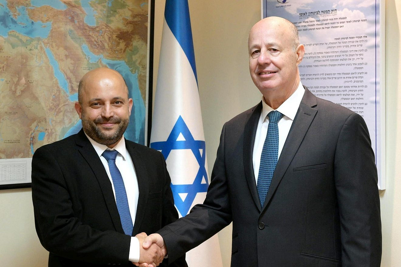 Eyal Hulata (left) with his successor as head of Israel's National Security Council, Tzachi Hanegbi, January 2023. Credit: Amos Ben-Gershom/GPO.