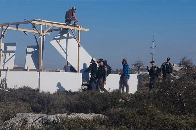 Israelis attempt to rebuild the Or Chaim outpost in Samaria after it was demolished, Jan. 22, 2023. Credit: Courtesy.