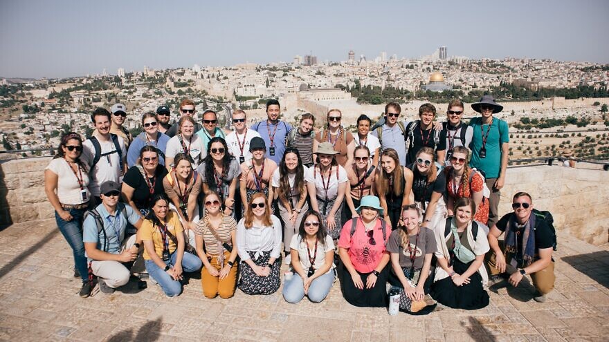 A Passages group poses on Jerusalem's Haas Promenade, with the Temple Mount in the background. Courtesy of Passages.