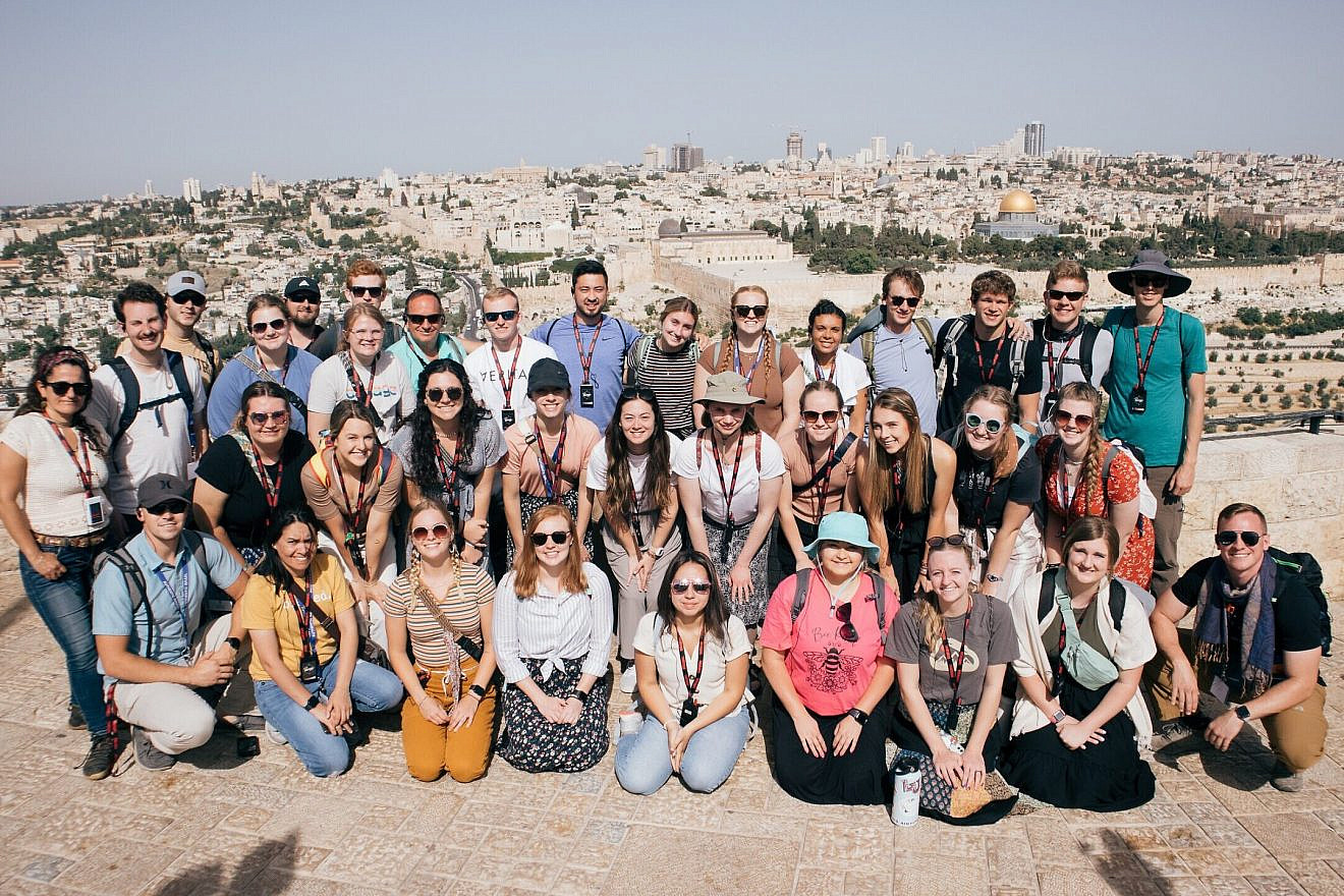 A Passages group poses on Jerusalem's Haas Promenade, with the Temple Mount in the background. Courtesy of Passages.