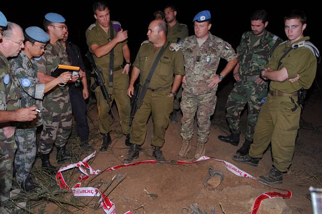 UNIFIL peacekeepers accompanied by IDF soldiers investigate a Katyusha rocket strike near Kiryat Shmona, Israel, Oct. 27 2009. Photo by Hamad Almakt/Flash90.