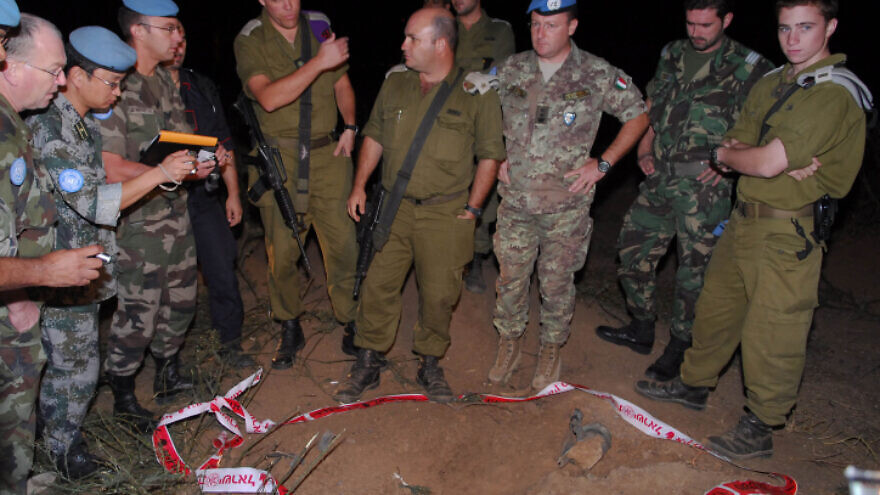 UNIFIL peacekeepers accompanied by IDF soldiers investigate a Katyusha rocket strike near Kiryat Shmona, Israel, Oct. 27 2009. Photo by Hamad Almakt/Flash90.