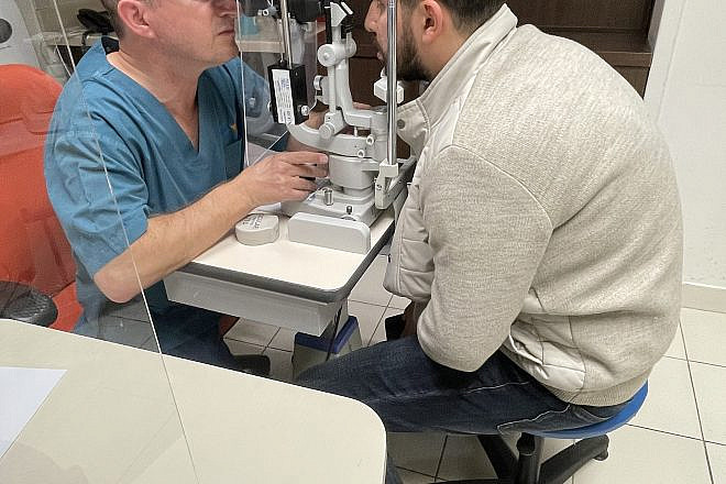 Dr. Yishay Falick examines Arif Hajiyev's cornea transplant at Misgav Ladach hospital in Jerusalem. Photo: courtesy
