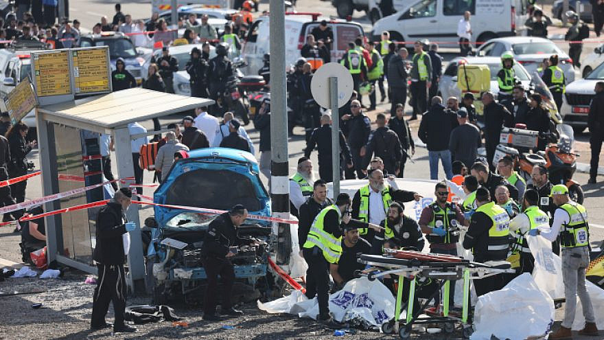 The scene of a terrorist attack in which an Israeli Arab drove a car into people at the Ramot neighborhood of Jerusalem, Feb. 10, 2023. Credit: Yonatan Sindel/Flash90.