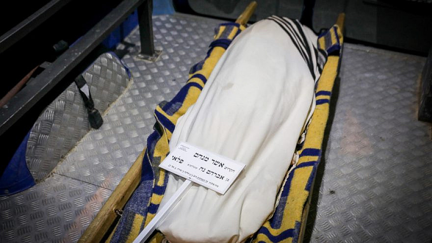 The body of Asher Menachem Paley, 7, is seen at his funeral in Jerusalem, Feb. 11, 2023. Photo by Noam Revkin Fenton/Flash90.
