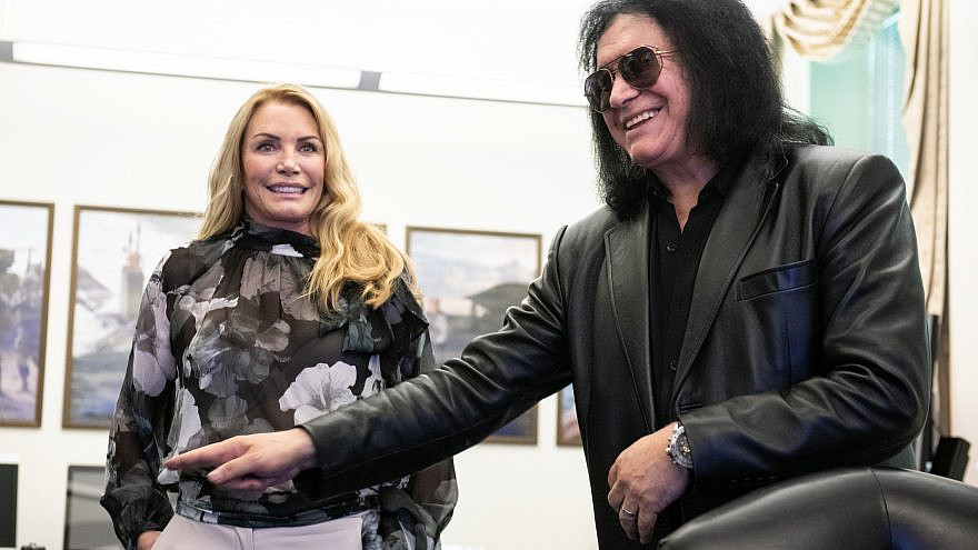 Gene Simmons, bassist and co-lead singer of the rock band KISS; and his wife Shannon Tweed-Simmons, visit the Pentagon meeting with members of the Joint Staff including Air Force Gen. Paul J. Selva, vice chairman of the Joint Chiefs of Staff, and Army Command Sgt. Maj. John W. Troxell, Senior Enlisted Advisor to the chairman of the Joint Chiefs of Staff, May 16, 2019. Credit: DoD Photo by U.S. Army Sgt. James K. McCann/Flickr via Wikimedia Commons.