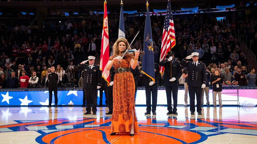 The violinist Miri Ben-Ari performs during the Euro Classic between Maccabi FOX Tel-Aviv and EA7 Armani Milano in Madison Square Garden in New York City on Oct. 4, 2015. Credit: Shutterstock.