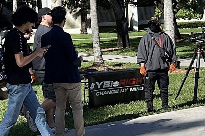 Antisemites man a table at Florida International University in Miami as part of the “Ye is Right” campaign, Feb. 10, 2023. Credit: Miami Against Fascism/Twitter.