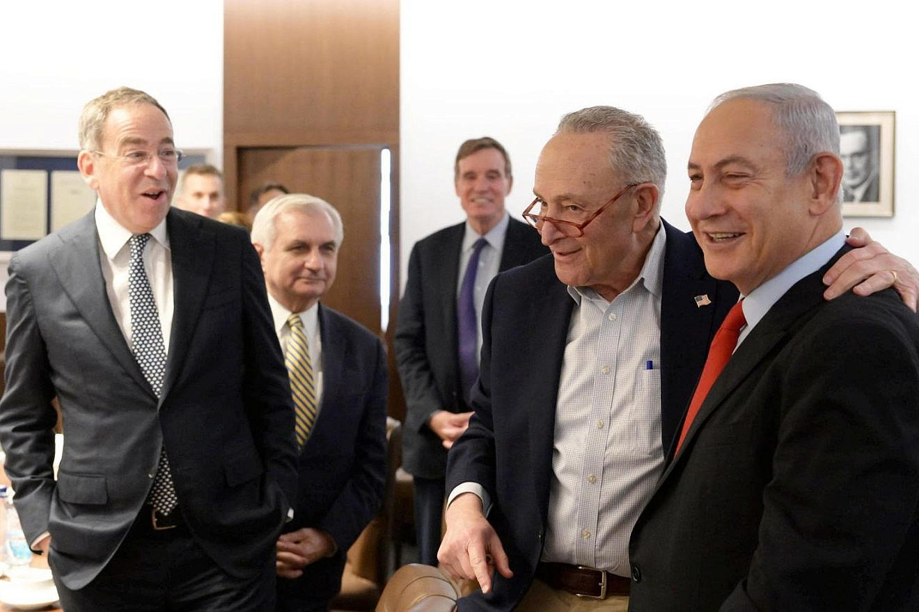 Israeli Prime Minister Benjamin Netanyahu in his Jerusalem office with a group of senators, led by Senate Majority Leader Chuck Schumer (D-N.Y.), while Israel Ambassador to the United States Thomas Nides (far left) looks on. Feb. 25, 2023. Photo by Amos Ben-Gershom.