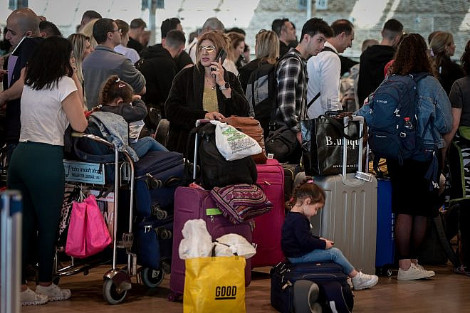 Travelers at Ben-Gurion International Airport, where flights were being delayed as the workers of the airport went on strike in a protest against the judicial overhaul proposed by the government on March 27, 2023. Photo by Avshalom Sassoni/Flash90.