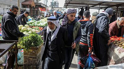 Palestinians shop in the market in Rafah, in the southern Gaza Strip, on February 1, 2022. Photo by Abed Rahim Khatib/Flash90/