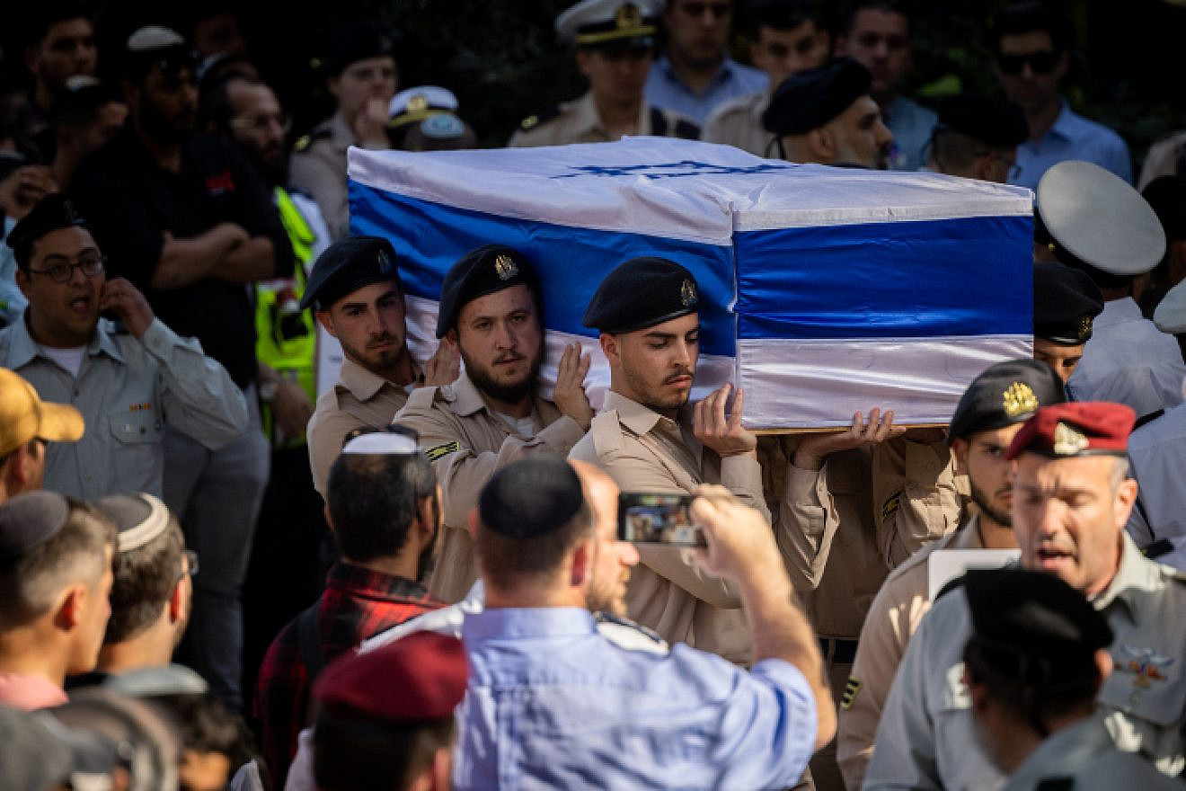 Friends and family attend the funeral of the Yaniv brothers Hallel, 21, and Yagel, 19, at the Mount Herzl military cemetery in Jerusalem. Photo by Yonatan Sindel/Flash90.