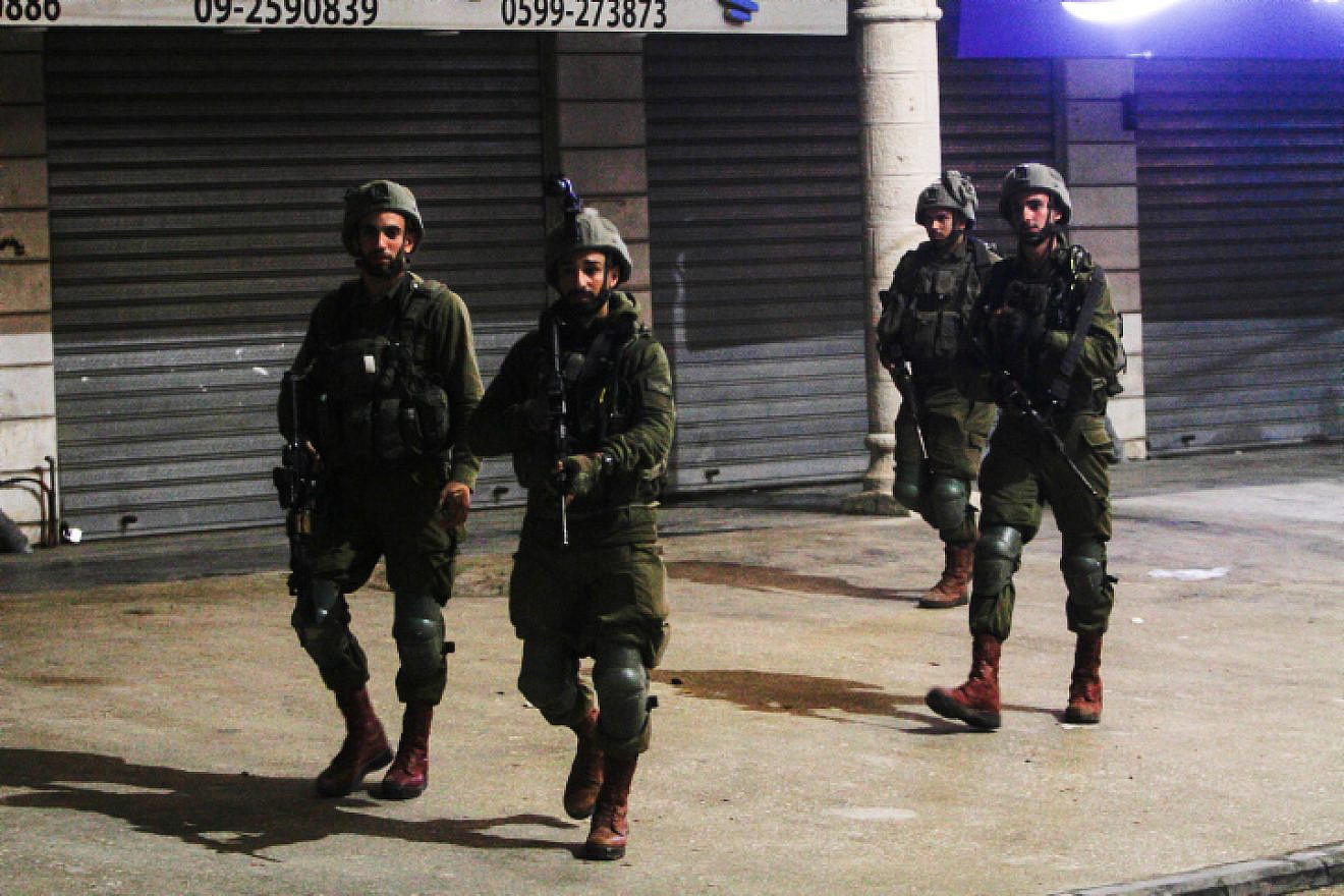 Israeli security forces secure the scene of a shooting attack in Huwara, in Samaria, near Nablus, March 25, 2023. Photo by Nasser Ishtayeh/Flash90